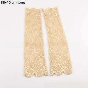 Detail of 40cm beige floral lace cooling arm sleeves with delicate scalloped edges