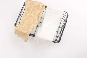 Detail of floral lace cooling arm sleeves in apricot and white colors for sun protection