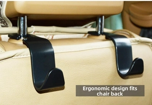 Detailed view of black S-shaped car seat hooks installed on headrest poles