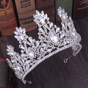 Elegant silver bridal crown with crystals and rhinestones on vintage wooden table