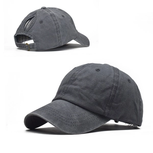 Detailed view of grey washed cotton baseball cap with functional high ponytail opening