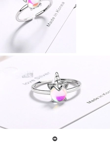 Detail of adjustable S925 silver unicorn ring featuring iridescent moonstone and hallmark