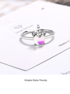 Detailed view of S925 sterling silver unicorn ring with colorful opal stone and engraving