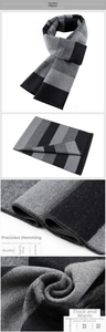 Detail view of thick grey striped winter scarf with premium stitching and fringe finish