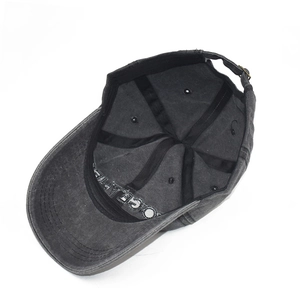 Detail of grey washed cotton baseball cap with sweatband and adjustable metal buckle