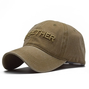 Detail of 3D embroidered 'TOGETHER' text on vintage washed khaki cotton baseball cap