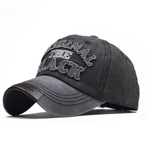 Detail of vintage grey and black mesh trucker hat with Original The Black embroidery