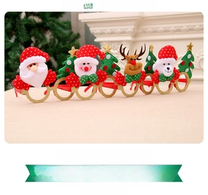Detail of Christmas party glasses featuring festive characters and glittery gold finish