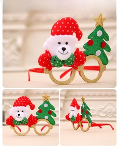 Detail of Christmas glasses featuring a white bear with Santa hat and glittery trees