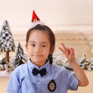 Bébé portant un serre-tête mini bonnet de Noël avec bordure pelucheuse pour fête de fin d'année