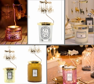 Detailed view of rotating golden metal candle carousel with reindeer and butterfly charms