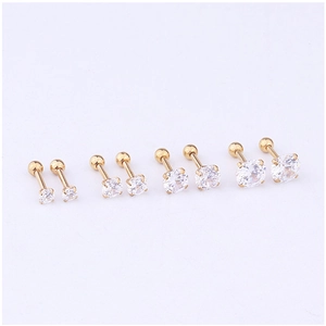 Set of four pairs of golden stainless steel stud earrings with round clear cubic zirconia