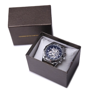 Silver automatic skeleton watch for men displayed in a premium black gift box with white cushion