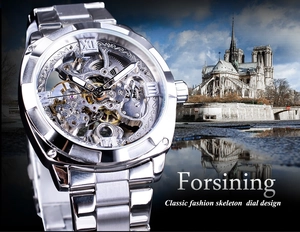 Detail showing skeleton mechanical watch movement and silver stainless steel gears