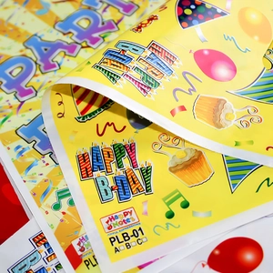 Glossy yellow Happy Birthday gift bags with colorful balloons and cake prints