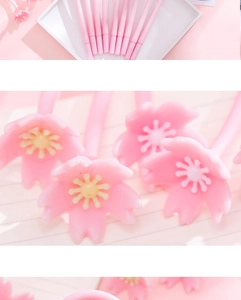 Detailed view of pink cherry blossom pen tips with soft silicone flower ornaments