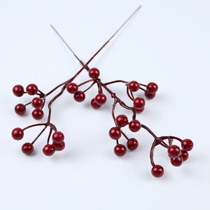 Macro view of artificial red pomegranate berries with glossy finish for Christmas decoration