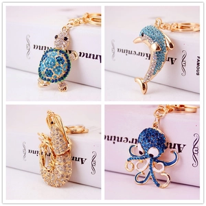 Glittering sea life keychains with rhinestone sea turtles, dolphins, and octopuses