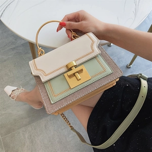 Chic tri-color patchwork handbag with metal ring handle and woven texture detail