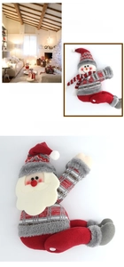 Detailed view of Christmas Santa and snowman dolls made of red and grey knitted fabric