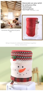 Close-up of snowman water dispenser cover with red scarf and knitted fabric detail
