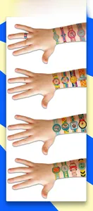 Child showing colorful temporary tattoos with unicorn and rainbow designs on skin