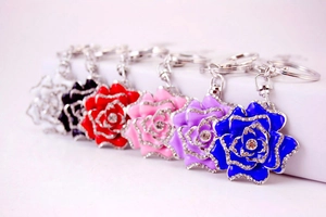 Detail of flower car keychains in six vibrant colors with rhinestones and enamel finish
