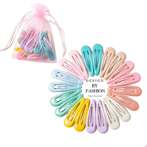 Detailed arrangement of colorful macaron candy color hairpins in a mesh gift bag