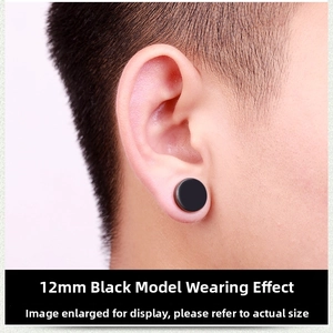 Side view of a 12mm black magnetic earring worn by a model in a minimalist punk style