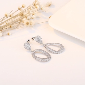 Elegant S925 silver water drop earrings with zircon crystals on a white surface