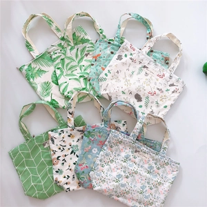 Artistic cotton canvas tote bags with various floral and animal prints on white background