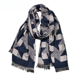 Detail of dark blue and grey geometric pattern scarf with natural fringe edges
