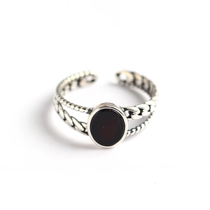 Retro S925 sterling silver open ring featuring an oval black onyx and braided band texture