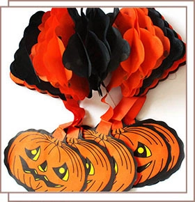 Hanging Halloween decoration featuring orange pumpkin cards and black paper honeycombs