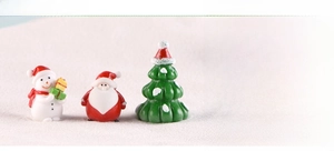 Detailed view of resin Christmas snowman, Santa Claus and tree miniatures for micro landscapes