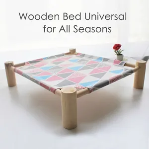 Elevated wooden pet hammock bed with colorful geometric pattern for cats and dogs