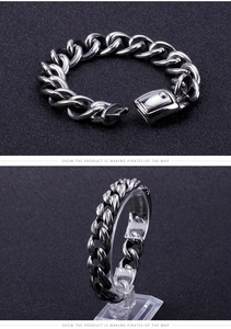 Detailed view of silver stainless steel Cuban link bracelet with secure box clasp