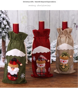 Close-up of burlap Christmas wine bottle bags with Santa and snowman felt appliques