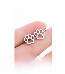 Detail of silver cat paw stud earrings showing hollow-out animal footprint design