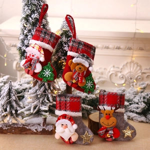 Set of four 3D Christmas stockings featuring Santa, Snowman, Bear, and Reindeer motifs