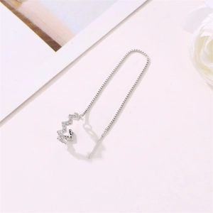 Close-up of silver Z-shaped geometric ear cuff with sparkling cubic zirconia stones