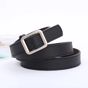 Close-up of black leather belt featuring a silver square buckle and fine stitching detail