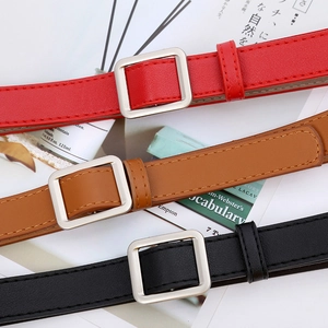 Detailed view of women's slim PU leather belts in red, brown and black with silver buckles