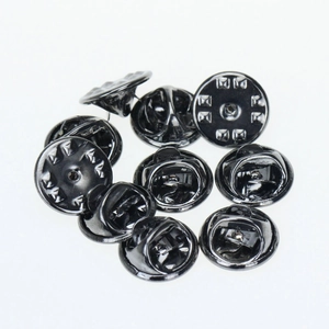 Macro detail of high-quality black metal butterfly clutch backs for pins and brooches