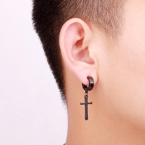 Men's black stainless steel cross drop earrings worn on ear with minimalist hoop design