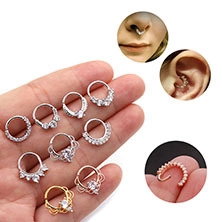 Detailliertes Set aus zirkonia-besetzten Ohrclips und Nasenringen in Gold und Silber