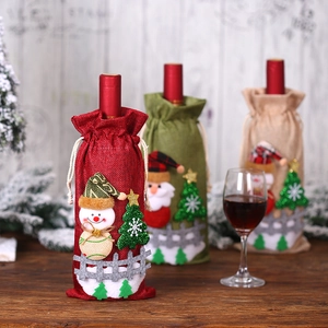 Trois housses de bouteille de vin de Noël en toile de jute avec motifs père Noël et bonhomme