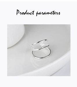 Macro shot of minimalist S925 sterling silver triple-layer spiral ear cuff jewelry