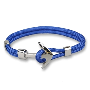 Macro detail of nautical blue woven rope and silver anchor clasp on men's bracelet
