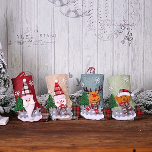 Set of four linen Christmas stockings with Santa, Snowman, Reindeer, and Bear 3D figures